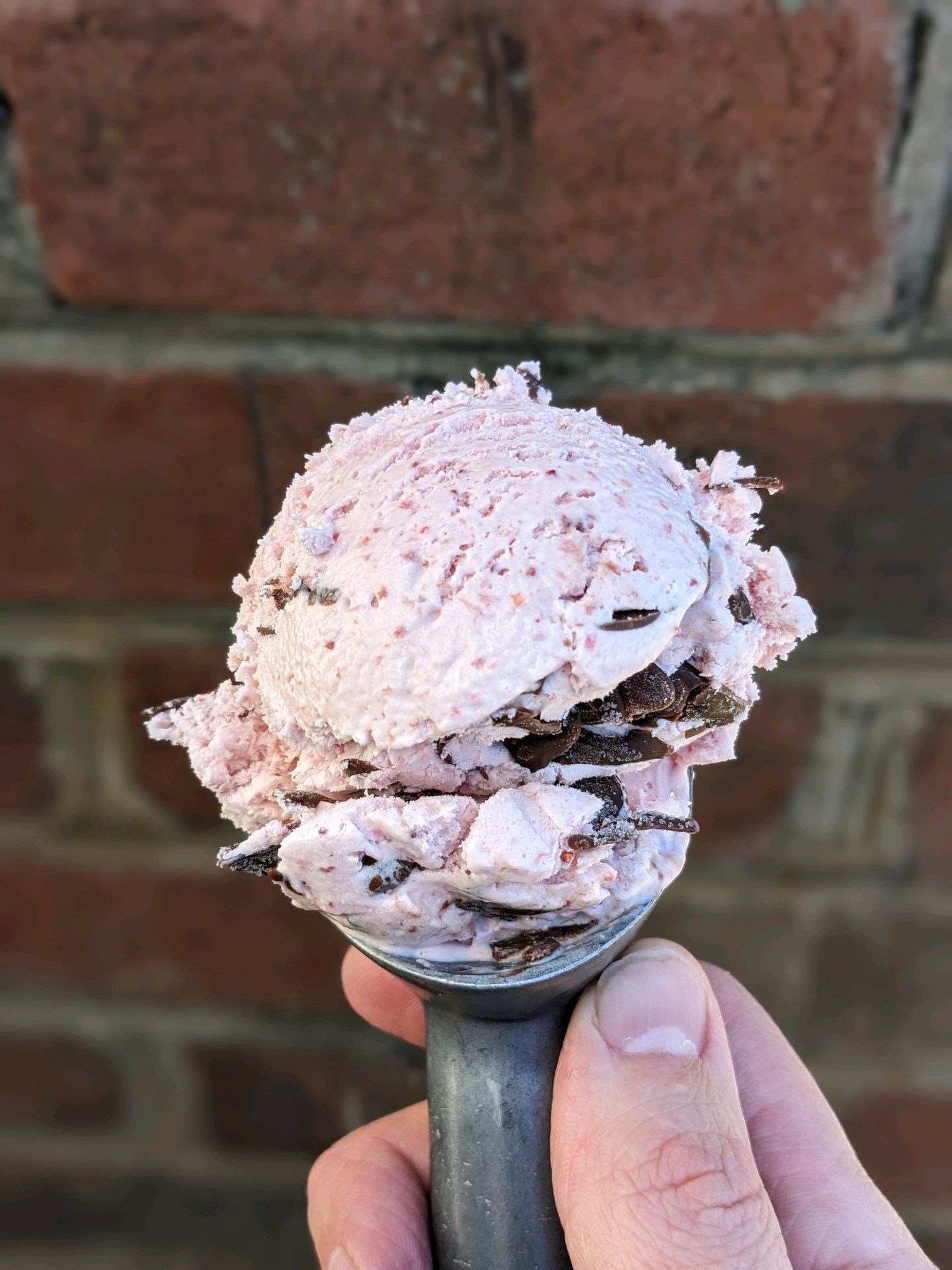 scoop of chocolate covered strawberry ice cream.